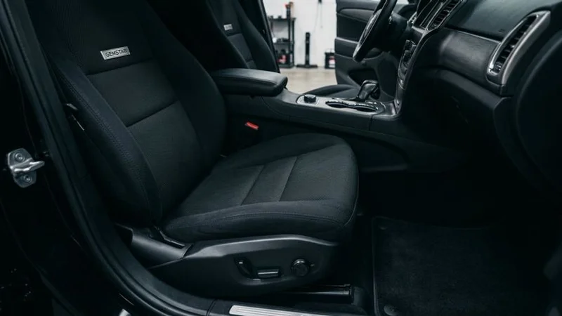 A freshly detailed car interior completely free of pet hair with clean fabric seats and spotless carpet after professional cleaning